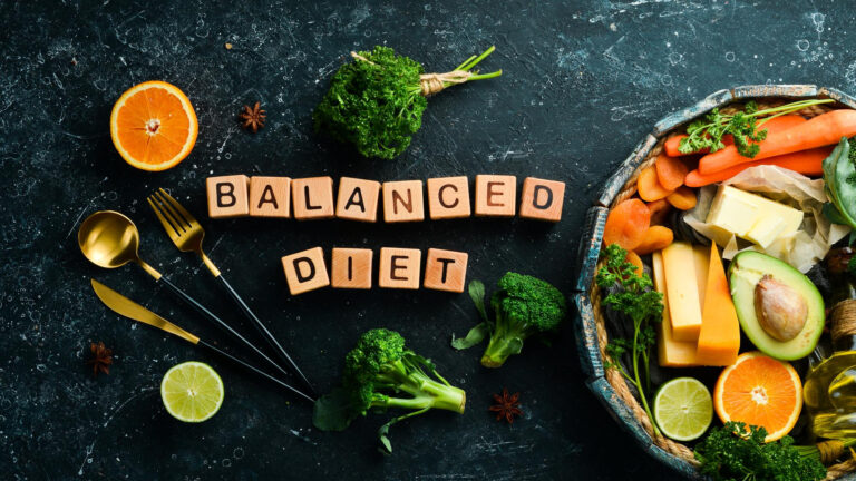 balanced diet inscription avocado carrot orange broccoli dried fruits nuts parsley top view free space your text